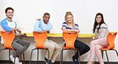 Four students at a table graphic.